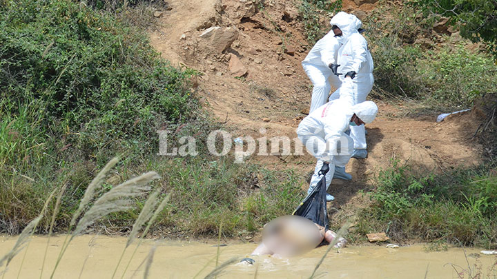 Cuando la Brigada Interinstitucional de Homicidios (Brinho) sacó el cuerpo se dio cuenta de que presentaba una herida abierta desde el cuello hasta la pelvis.