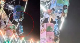 Mujer queda colgando de rueda de la fortuna