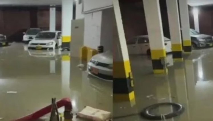 Dramático rescate: hombre casi se ahoga en parqueadero inundado por las lluvias